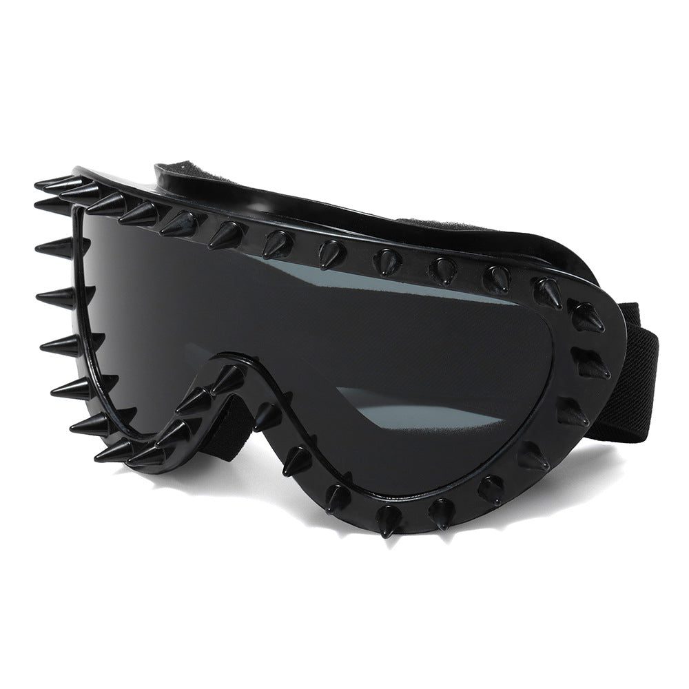 Outdoor women's goggles, black with spike design, offering UV protection & style.