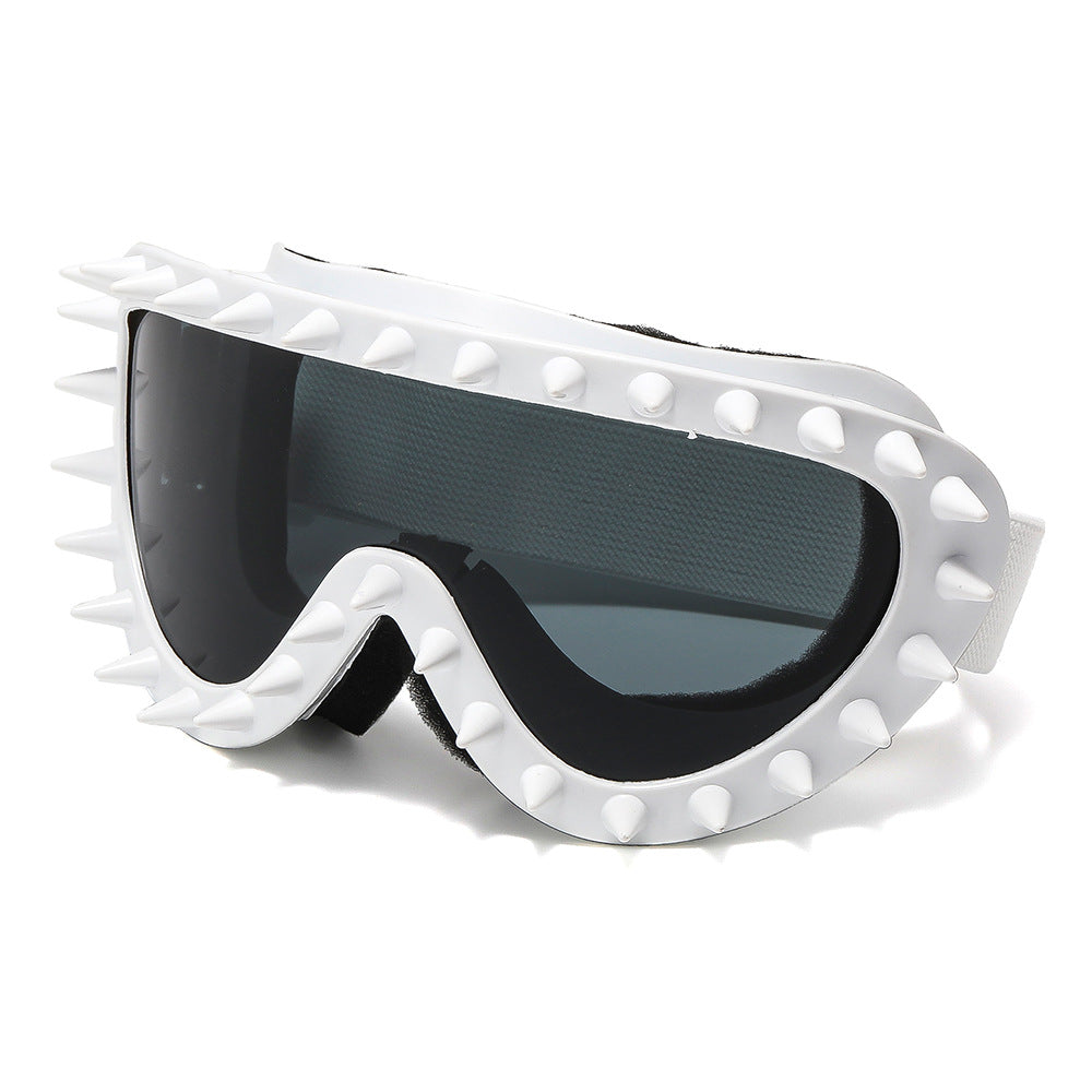 Black women's goggles with edgy spike design, providing protective and trendy eyewear.