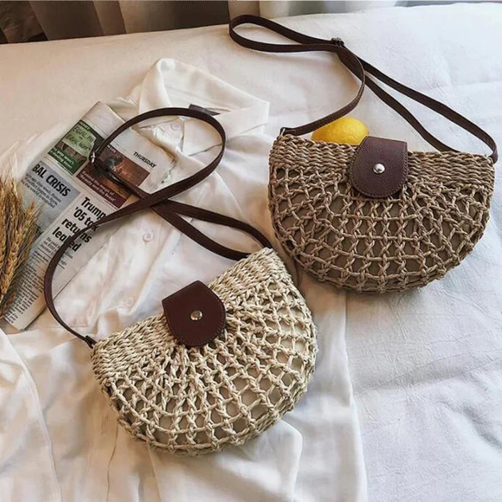 Chic women's straw handbag with braided design, perfect as a crossbody or shoulder bag.
