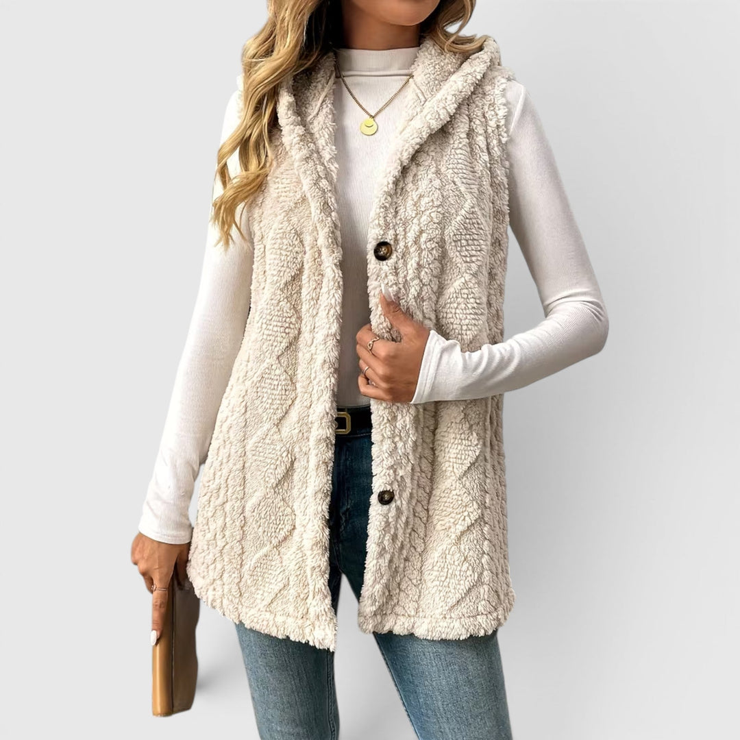 Women's stylish button-front hooded vest, perfect for layering & transitional weather.