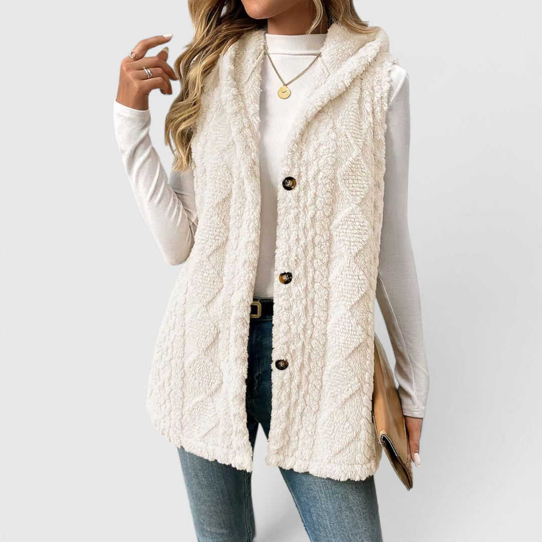 Cozy hooded vest for women, button-front style, ideal for casual layering.
