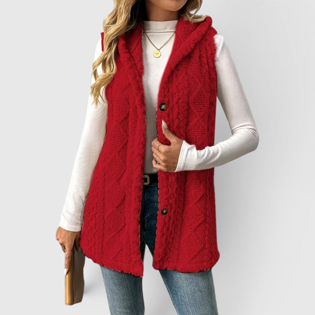Stylish women's outerwear vest, hooded & button-up, perfect for transitional fashion.