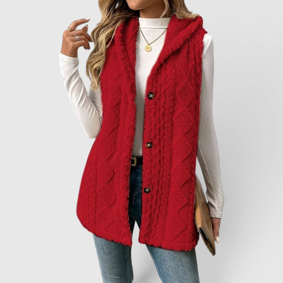 Women's button-front hooded layering vest, versatile and chic for everyday wear.