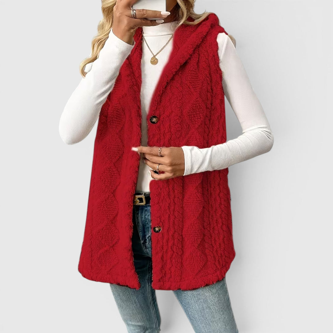 Stylish women's button-front hooded vest, ideal outerwear for versatile fashion.