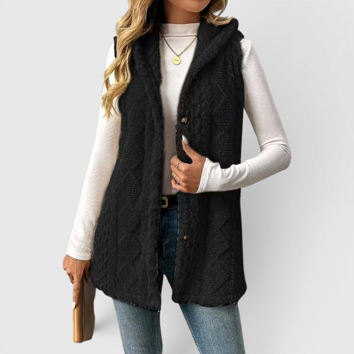 Women's transitional hooded vest, sleeveless & buttoned, great for casual chic.