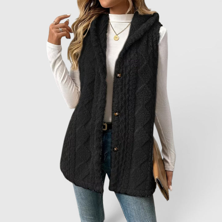 Women's sleeveless hooded outerwear, button-front for a fashionable & practical layer.