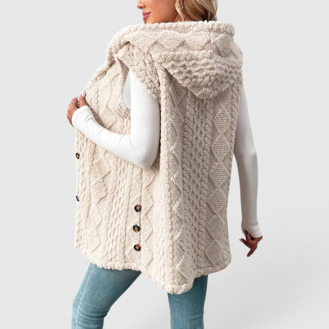 Cozy women's sleeveless jacket with hood & front buttons, versatile fashion.