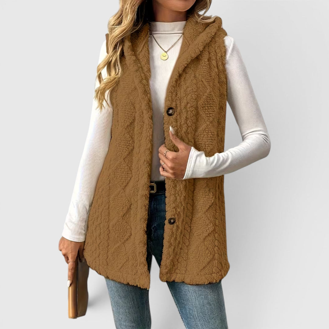 Women's fashion vest with hood & buttons, perfect layering piece for cool days.