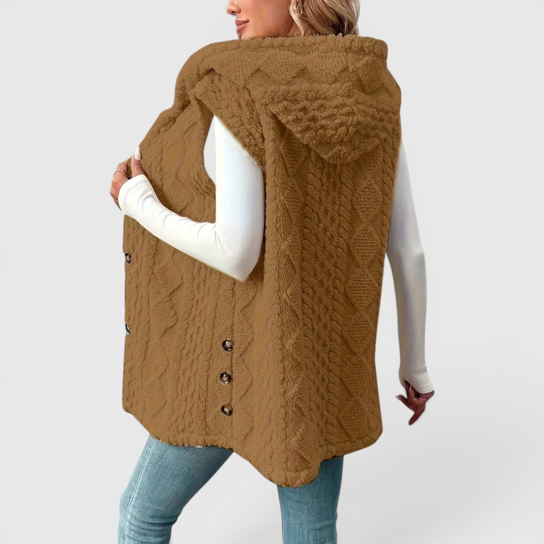 Stylish women's hooded vest, button-front for easy wear & versatile looks.