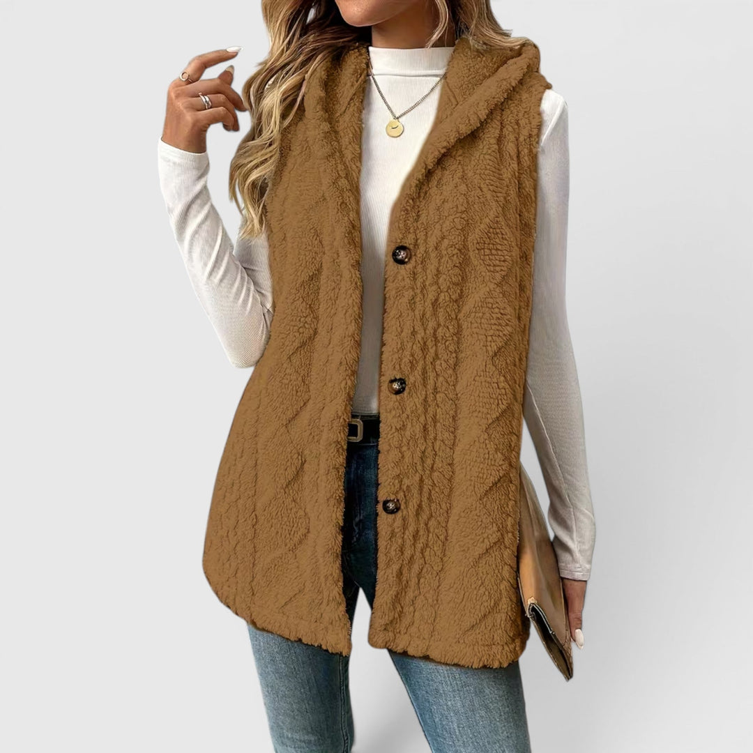 Women's hooded layering vest, button-up design, adds warmth & style to any outfit.
