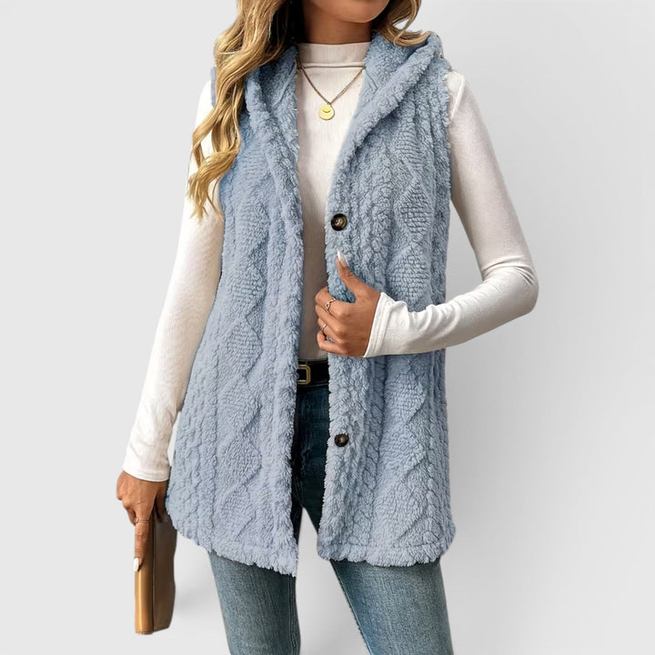 Cozy women's button-front hooded vest outerwear, perfect for transitional fashion.