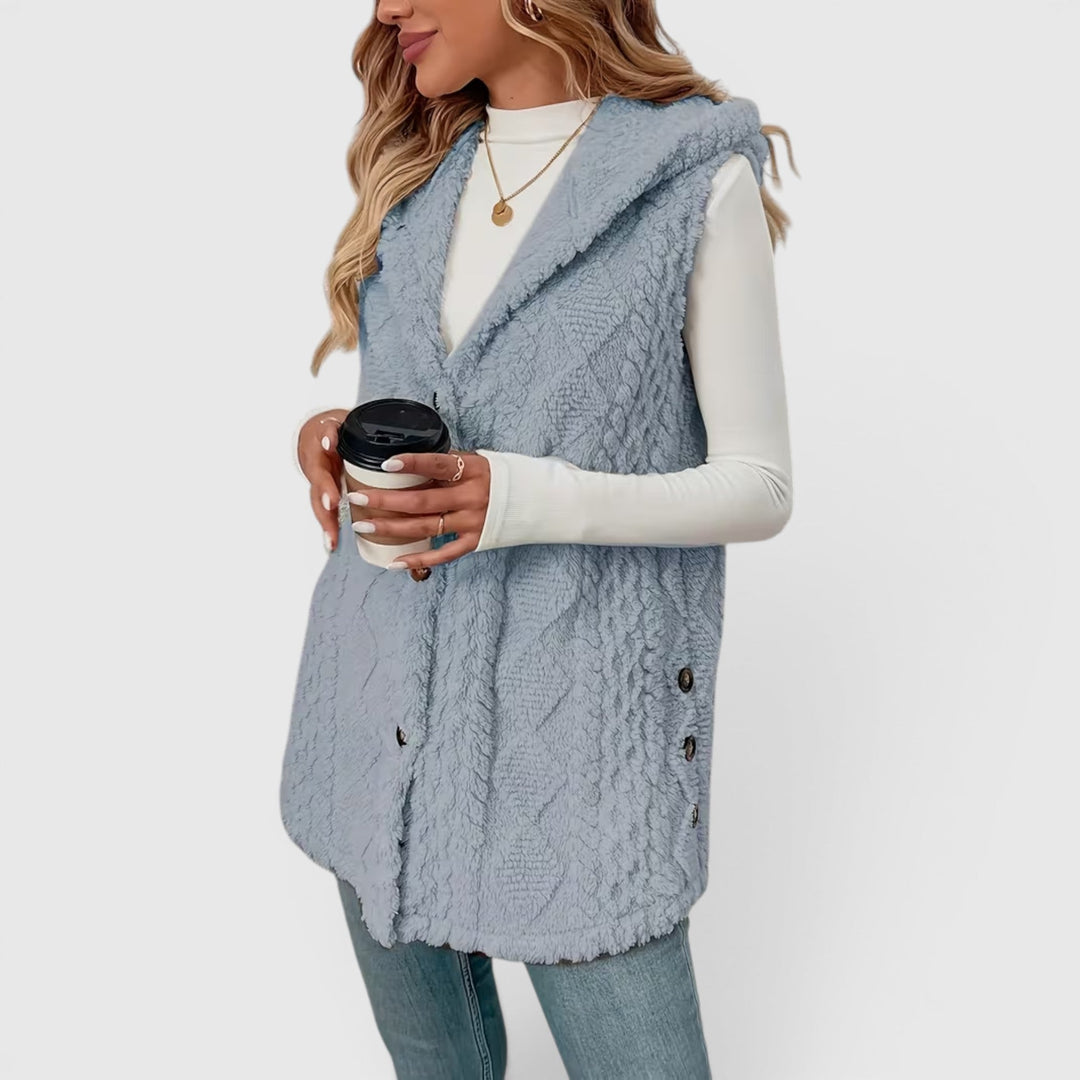Fashionable women's hooded vest, button-up style, great for versatile casual wear.