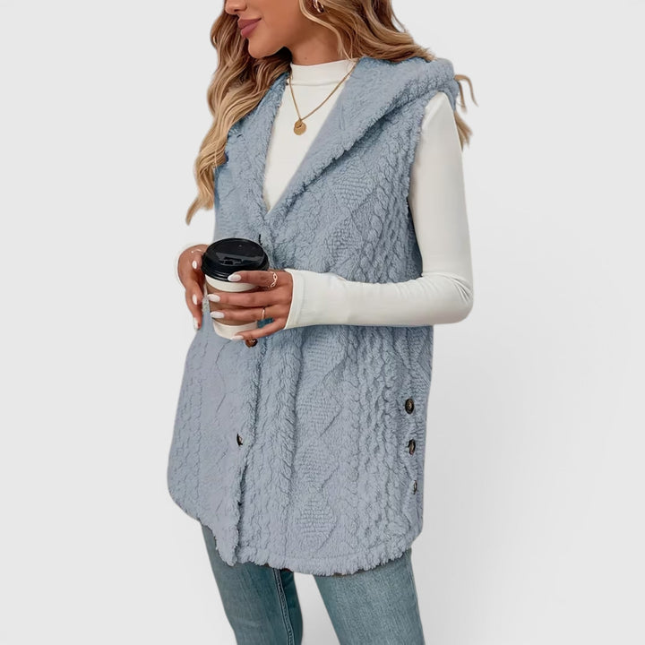 Fashionable women's hooded vest, button-up style, great for versatile casual wear.