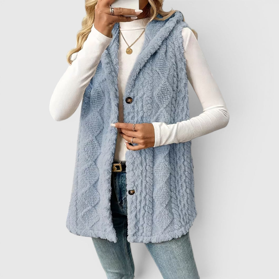Women's sleeveless button-front hooded vest, perfect for adding a cozy layer.