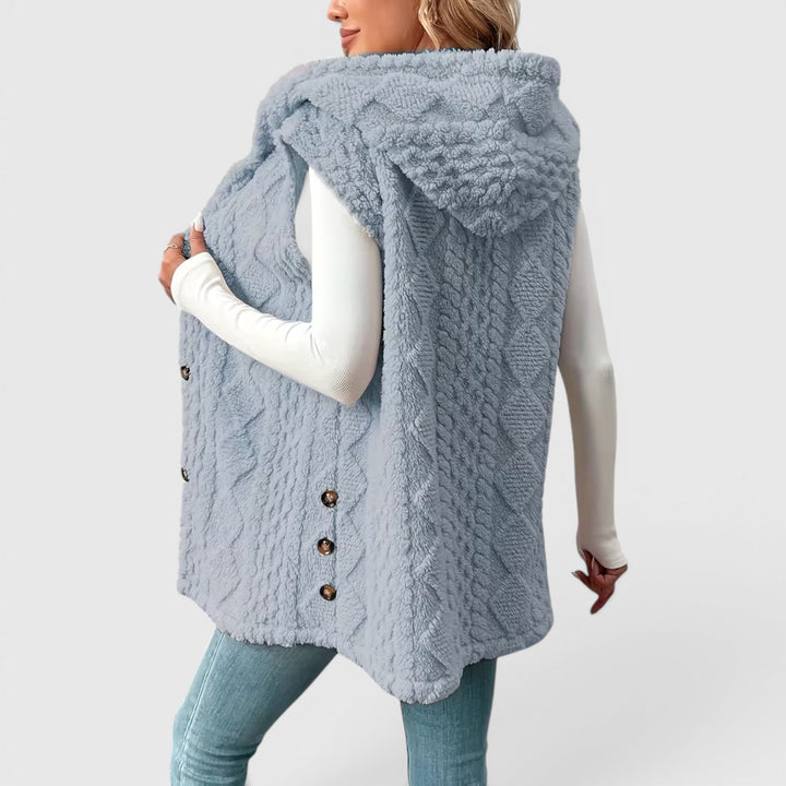 Stylish women's hooded vest with button front, essential for comfortable outerwear.