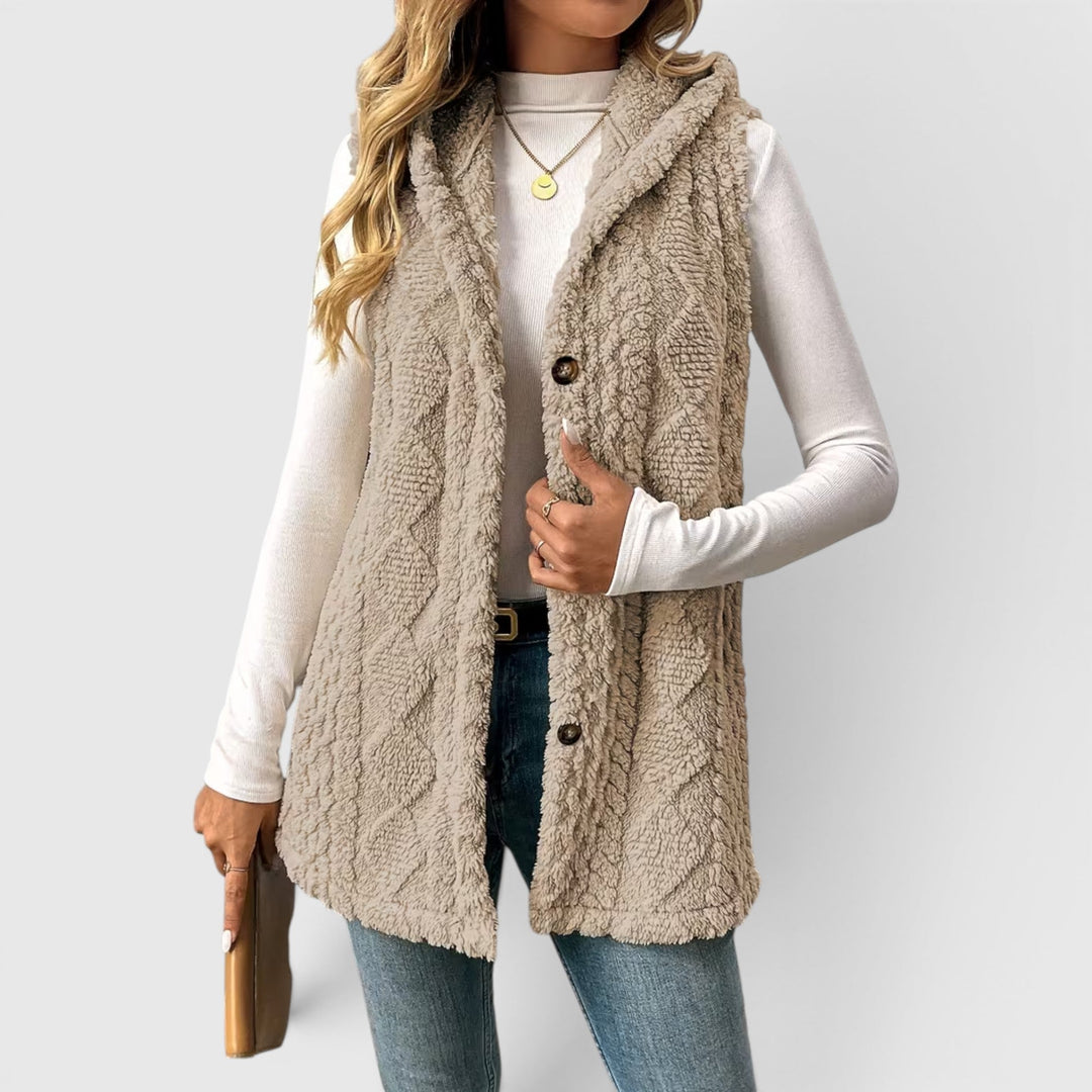 Casual women's button-front hooded vest, perfect for layering & everyday style.