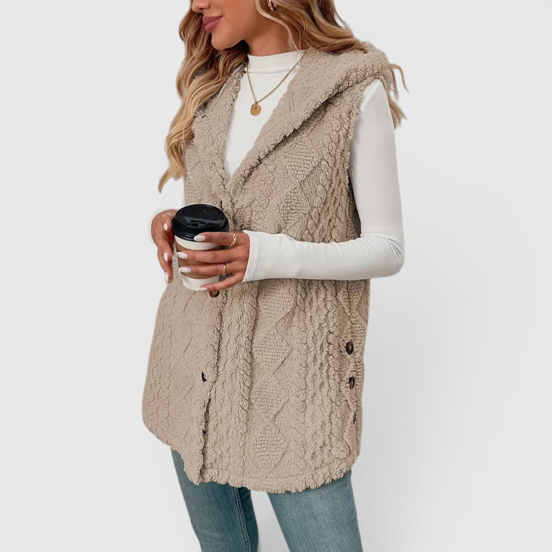 Stylish women's sleeveless hooded vest, button-front, perfect for versatile fashion.