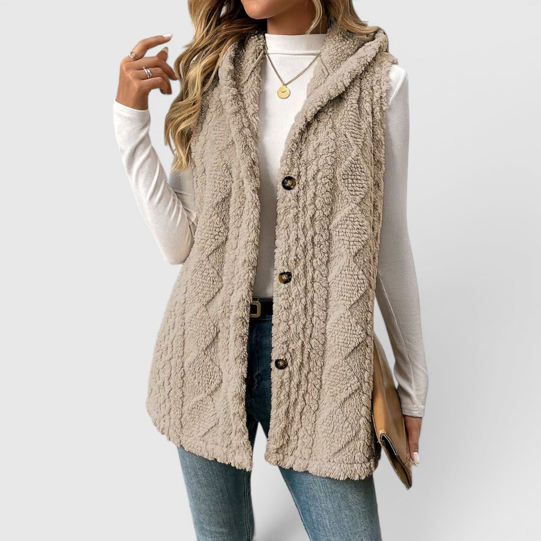 Women's button-front hooded vest, ideal for layering, casual chic, & comfort.