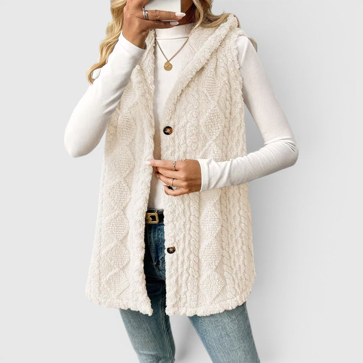 Versatile women's button-front hooded vest, cozy & stylish for any season.