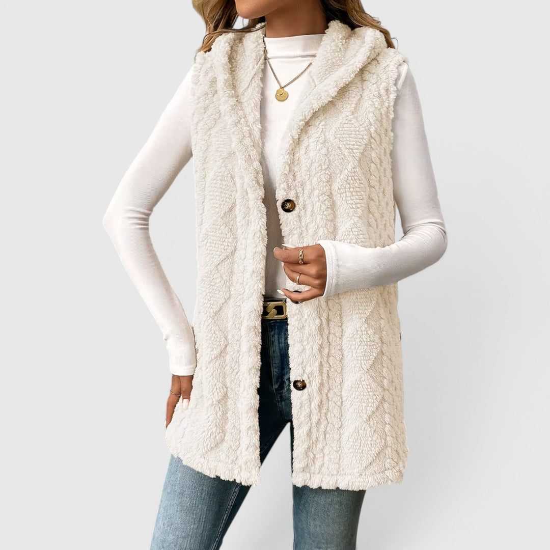Fashionable women's button-front vest with hood, perfect for layering & comfort.