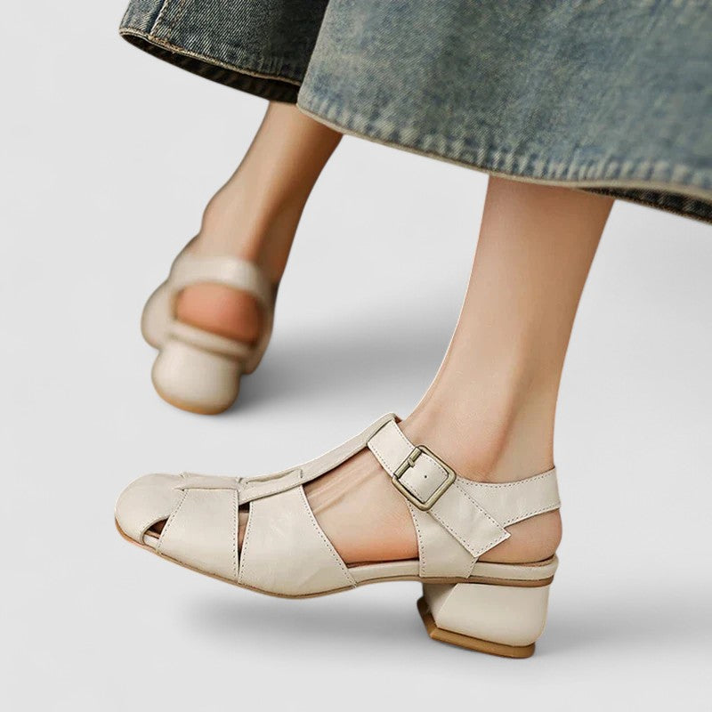 Comfortable women's closed-toe sandals with a low heel, perfect for stylish summer and spring outfits.