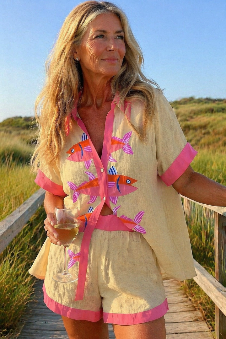 Women's stylish cream summer two-piece shorts set. Relaxed fit, comfortable for casual or vacation wear.