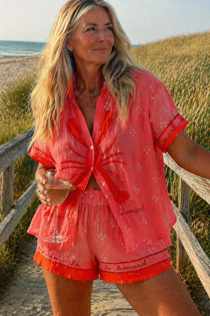 Pink women's summer two-piece shorts set, a stylish & comfortable casual outfit for warm weather.