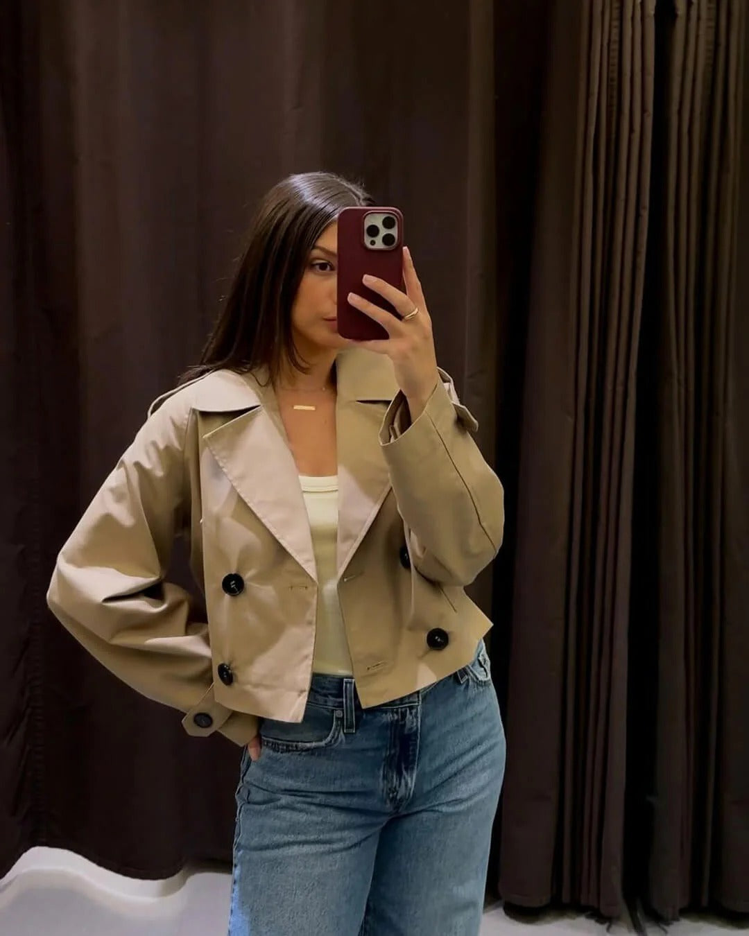 Khaki women's double-breasted short trench. Versatile & chic outerwear for a classic modern look.