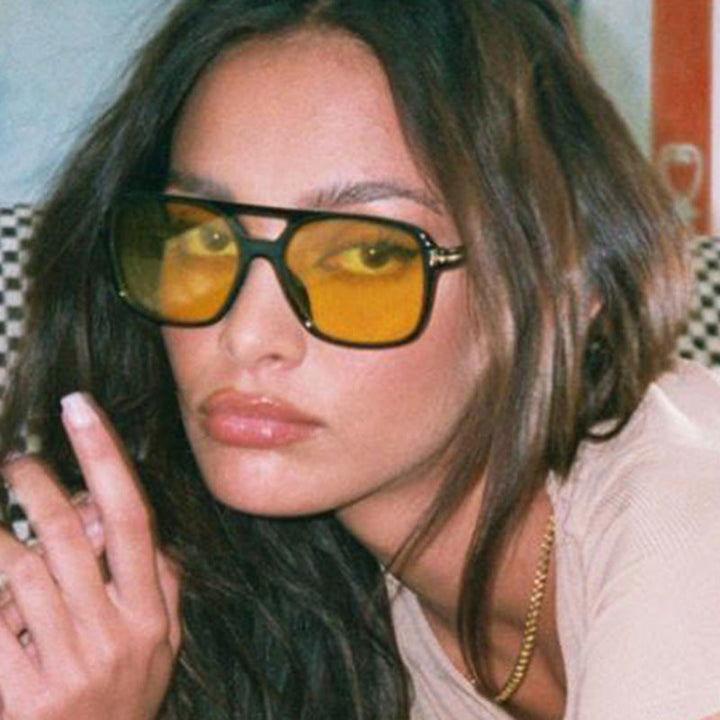 Chic women's fashion sunglasses with a unique frame, offering excellent UV protection.