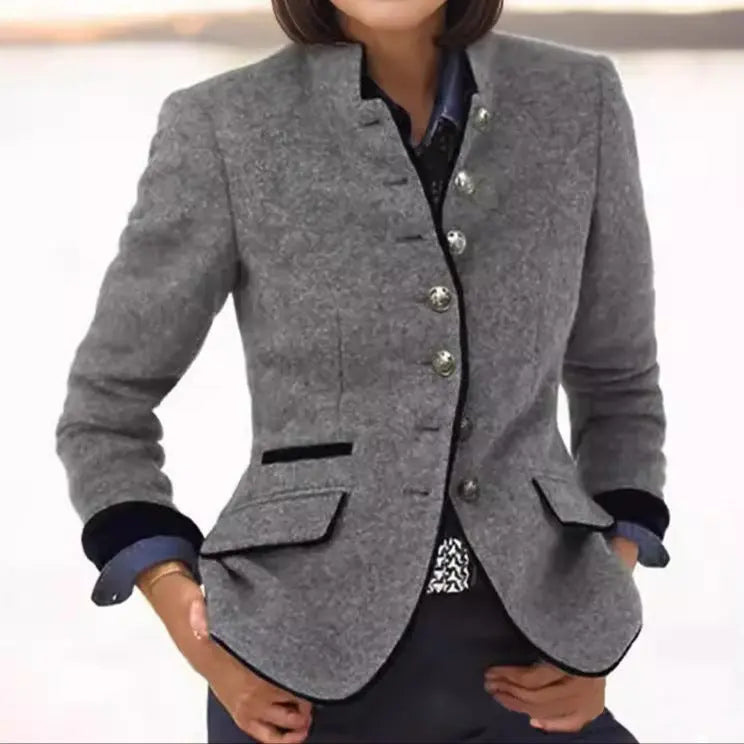 Versatile women's fitted blazer, collared and buttoned, featuring elegant trim detail. Ideal for work or smart casual.
