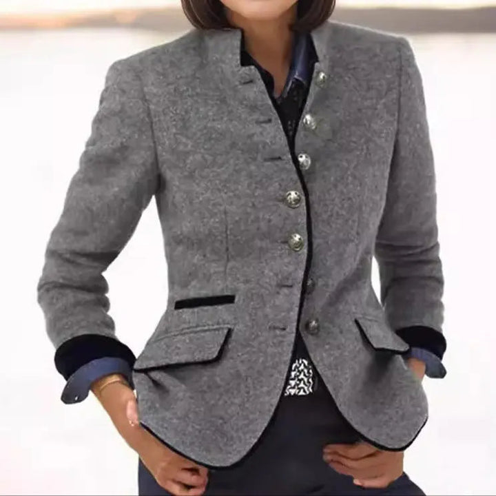 Versatile women's fitted blazer, collared and buttoned, featuring elegant trim detail. Ideal for work or smart casual.