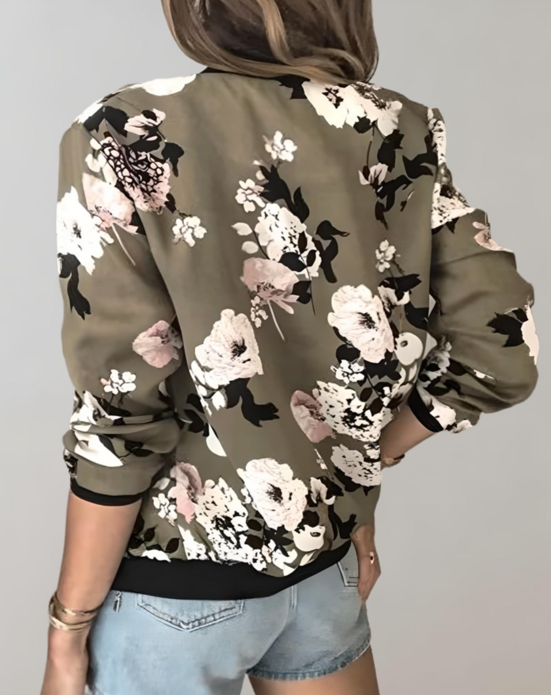 Chic women's floral bomber jacket, comfortable lightweight outerwear for a stylish casual spring look.