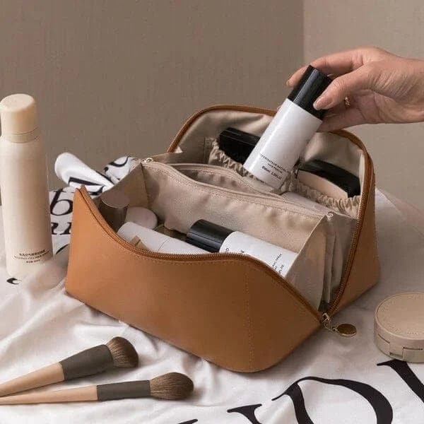 Portable leather cosmetic organizer bag for women, ideal for travel, keeping makeup and beauty essentials tidy.
