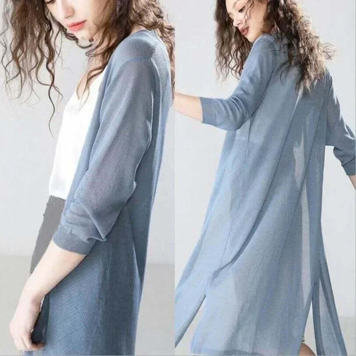 Warm women's long green cardigan, stylish outerwear for versatile fall and winter fashion.