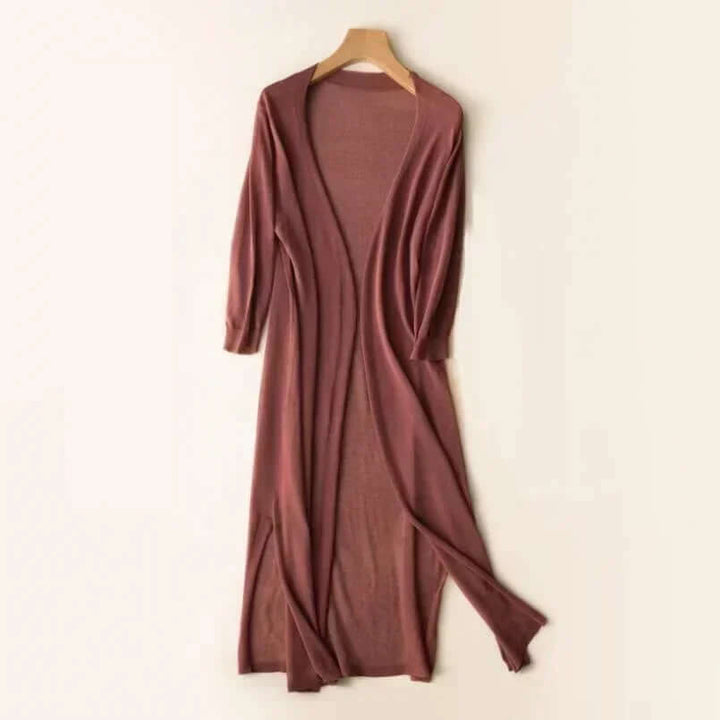 Elegant green long cardigan sweater, perfect for versatile winter fashion and effortless layering.