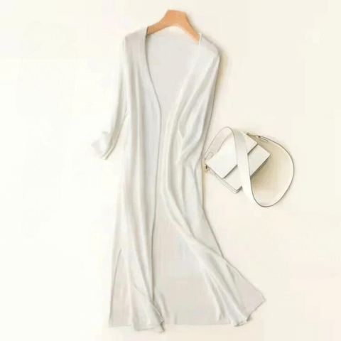 Elegant women's long green cardigan, a stylish sweater for fall and winter layering.