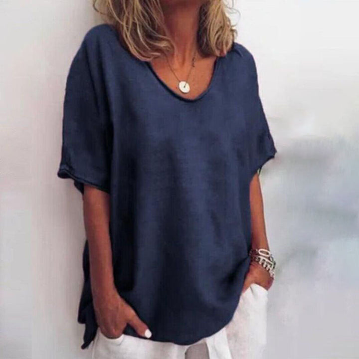 Flattering women's loose-fit blouse, stylish and comfortable, great for versatile elegant wear.