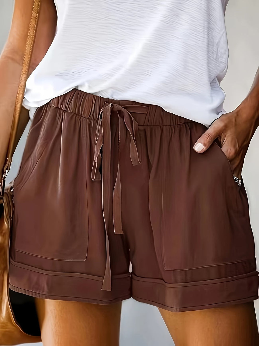 Women's summer fashion shorts, offering a relaxed fit and stylish look for leisure activities.