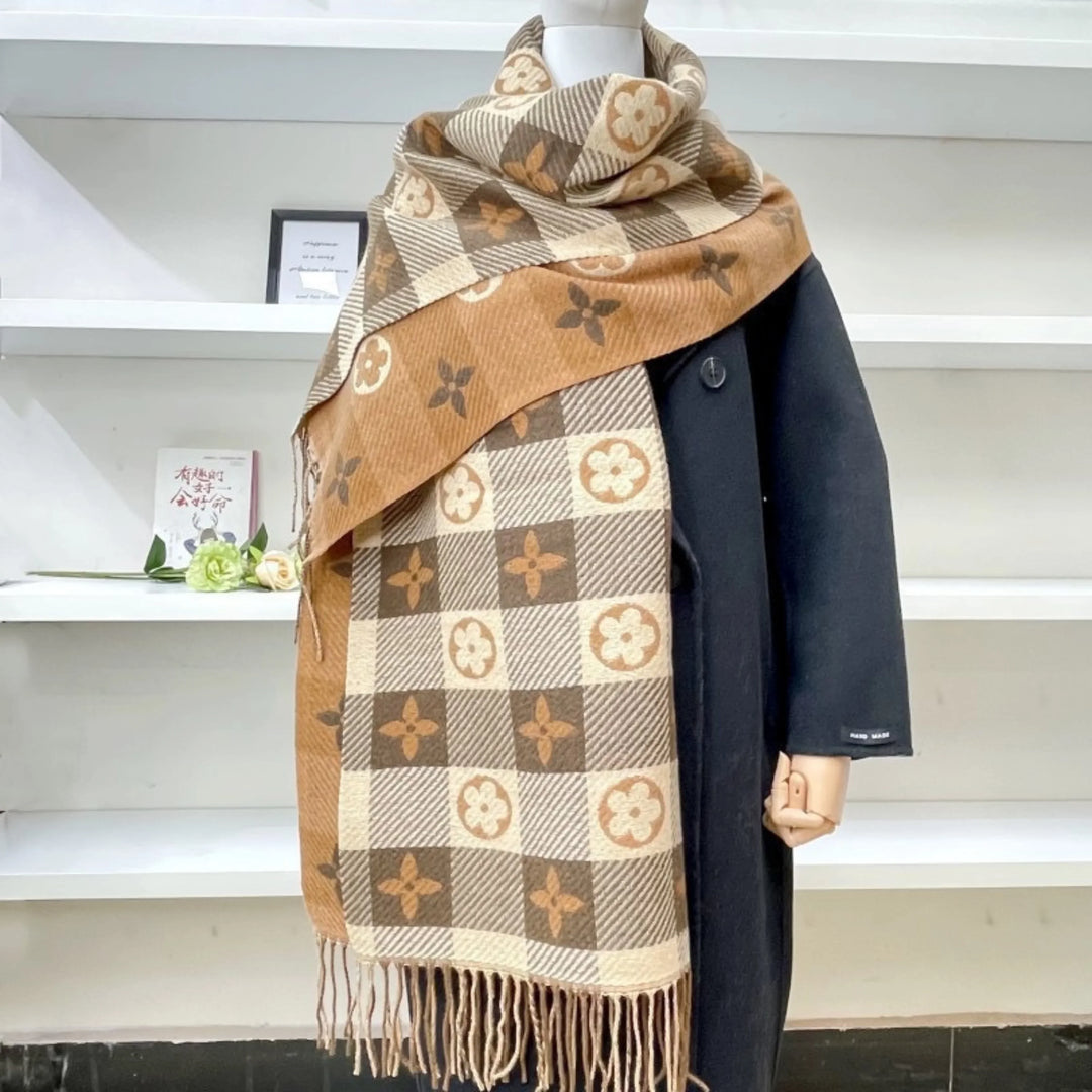 Drape yourself in this warm women's Mickey Plaid reversible scarf with fringed ends. Stylish winter accessory.