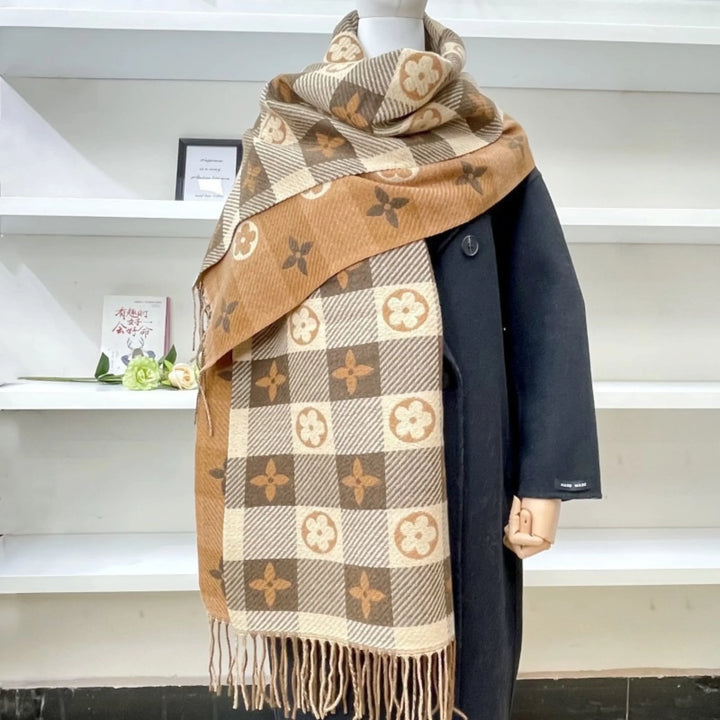 Drape yourself in this warm women's Mickey Plaid reversible scarf with fringed ends. Stylish winter accessory.