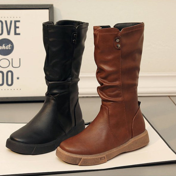 Chic women's mid-calf boots featuring a practical side zipper and low heel for comfortable all-day wear.