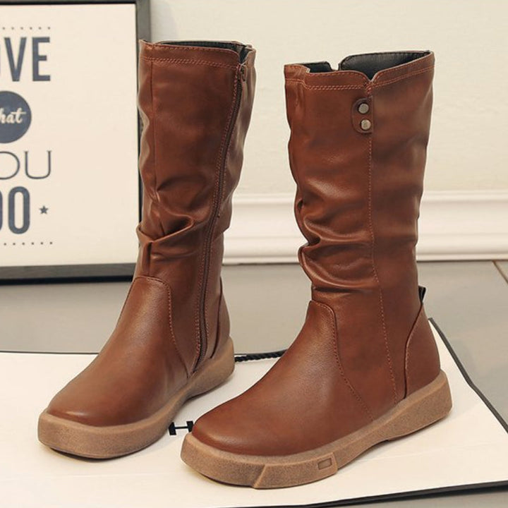 Versatile women's mid-calf boots with stylish design and convenient side zipper, perfect for everyday fashion.