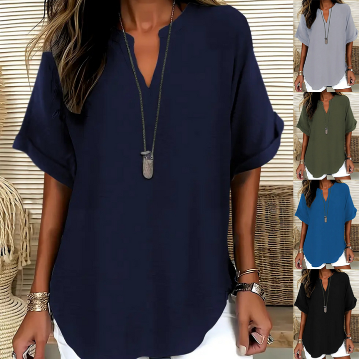 Women's stylish mid-sleeve V-neck blouse, perfect for casual or office wear.