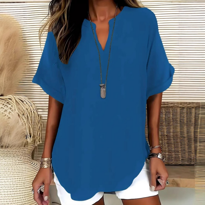 Elegant women's V-neck blouse with mid-sleeves & relaxed fit, ideal for versatile fashion.