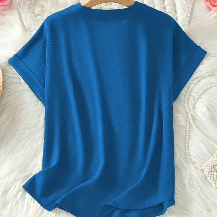 Women's elegant mid-sleeve V-neck blouse, a stylish & comfortable top for various occasions.