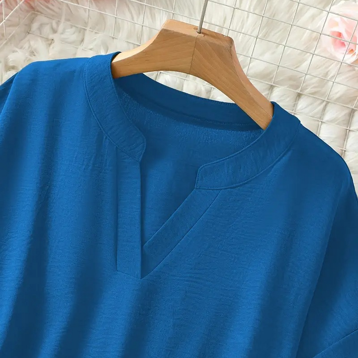 Stylish women's mid-sleeve V-neck blouse, versatile top for office, casual, & fashion looks.