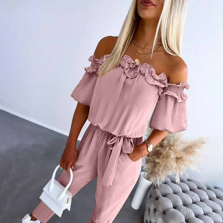 Elegant women's off-shoulder tie-waist jumpsuit with frill detail, a stylish and chic summer fashion piece.