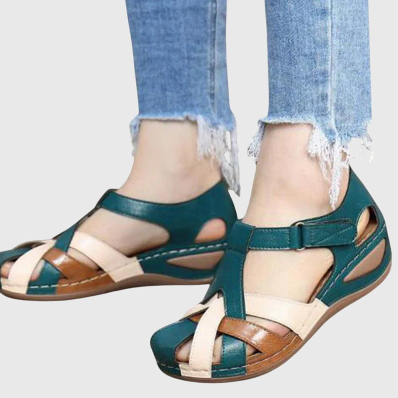 Women's comfort sandals with targeted arch support to relieve foot pain, stylish design & adjustable fit.