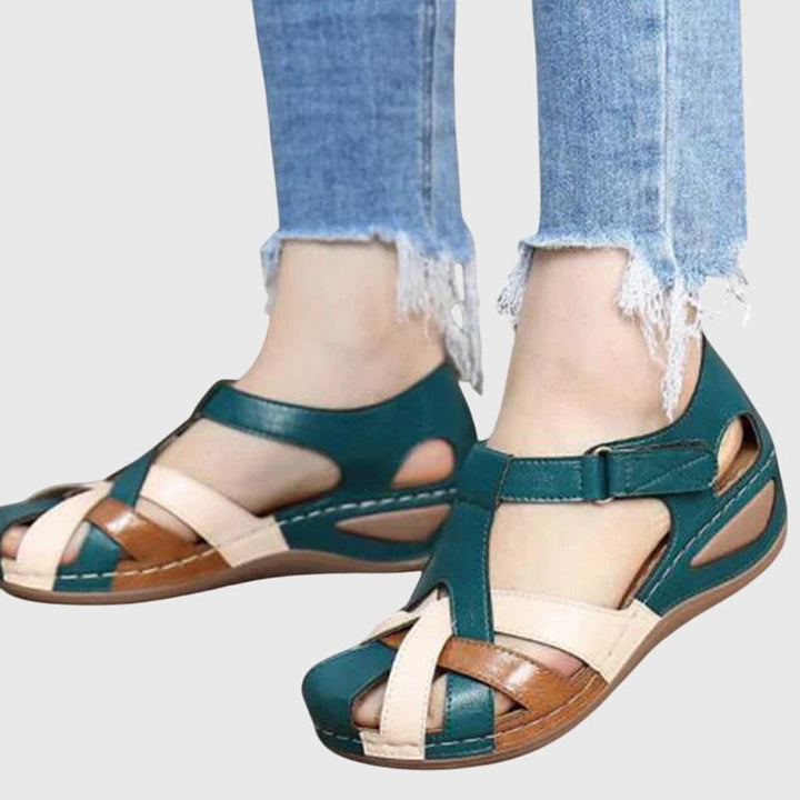 Women's comfort sandals with targeted arch support to relieve foot pain, stylish design & adjustable fit.