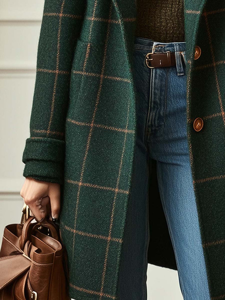 Warm women's plaid winter coat, mid-length style. Chic outerwear with a double-breasted front for elegant cold weather.
